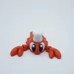 Langosta Chef articulada impresa en 3D en PLA+ roja, con sombrero de cocinero blanco